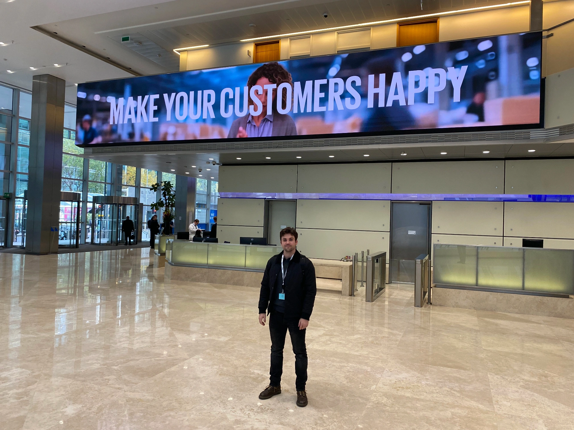 KPMG — installed lobby LED banner above reception, live content