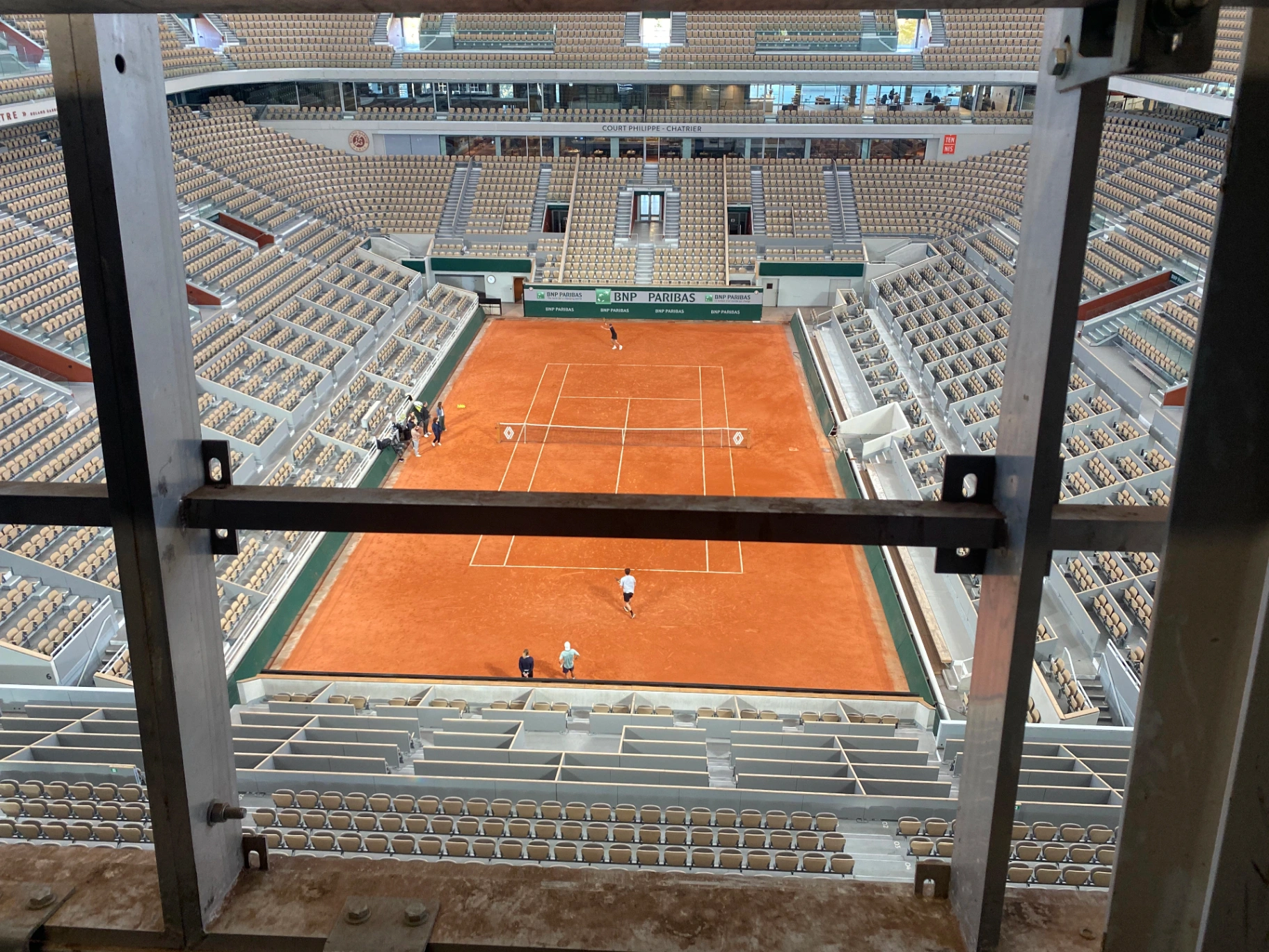 Roland Garros — court viewed through bespoke structural framing during install phase