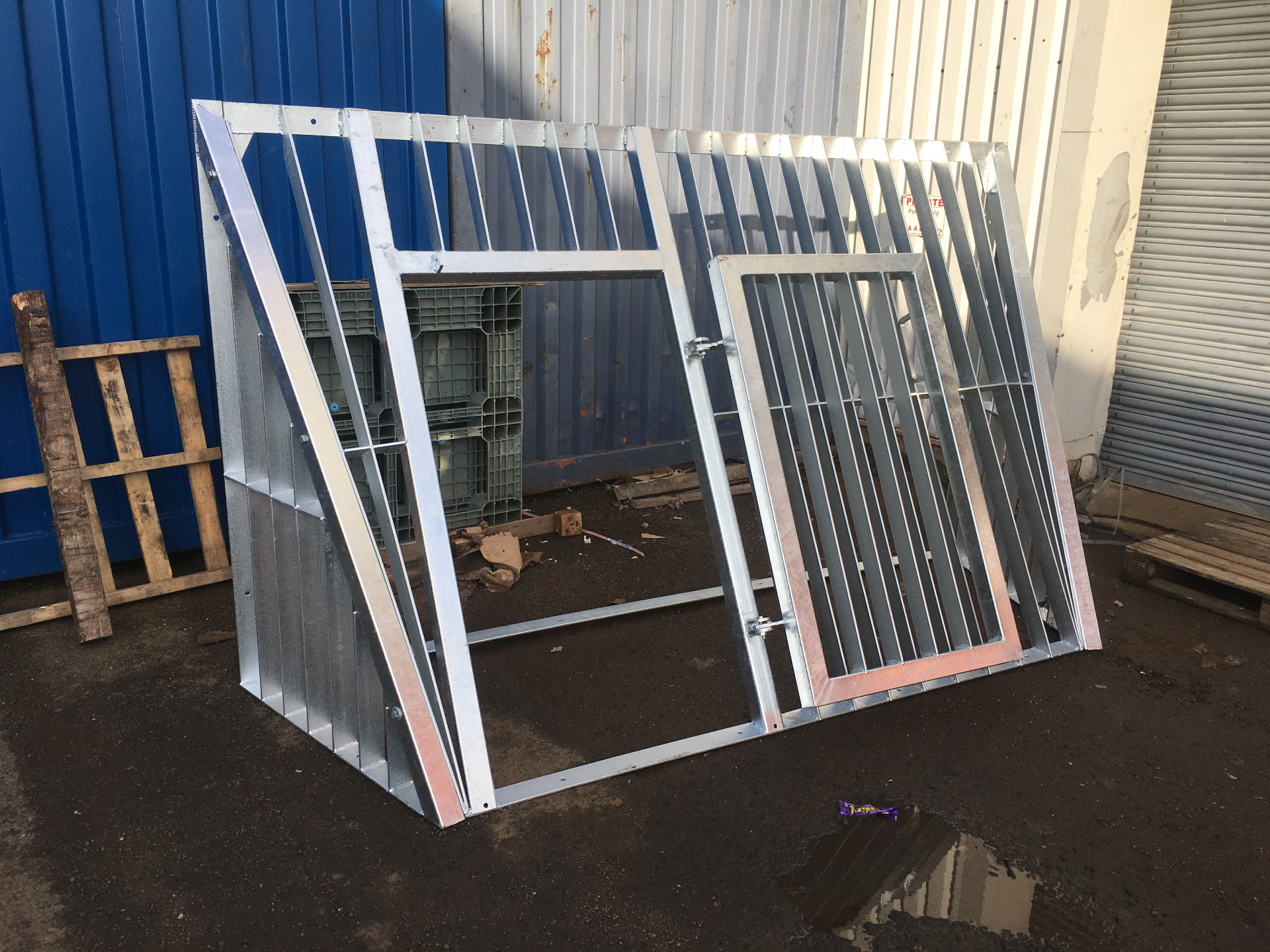 Sewer Barrier — fully fabricated and hot-dip galvanised barrier frame with hinged access door, pre-deployment