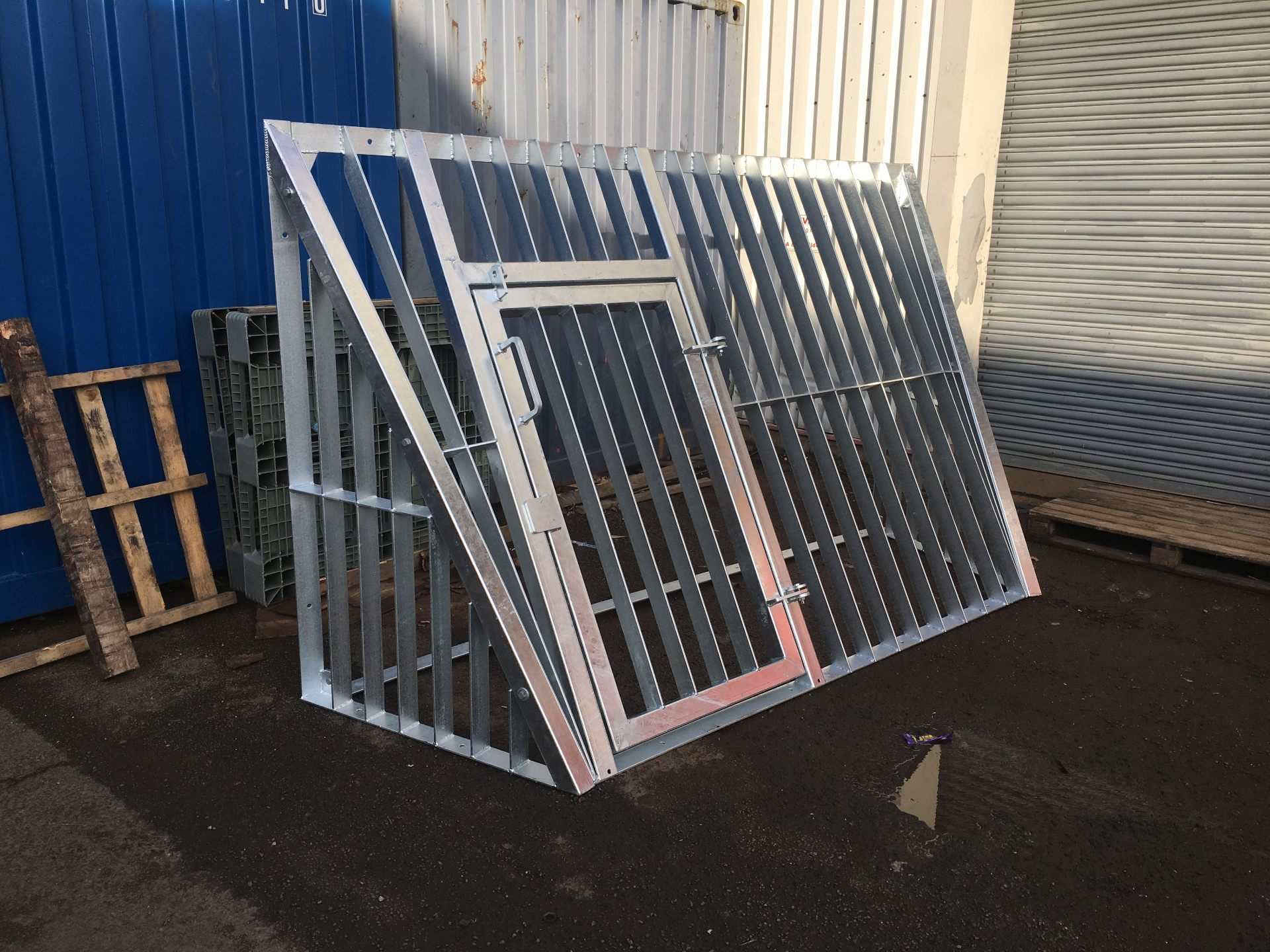 Sewer Barrier — galvanised barrier frame, three-quarter view showing hinged access door and bracing geometry