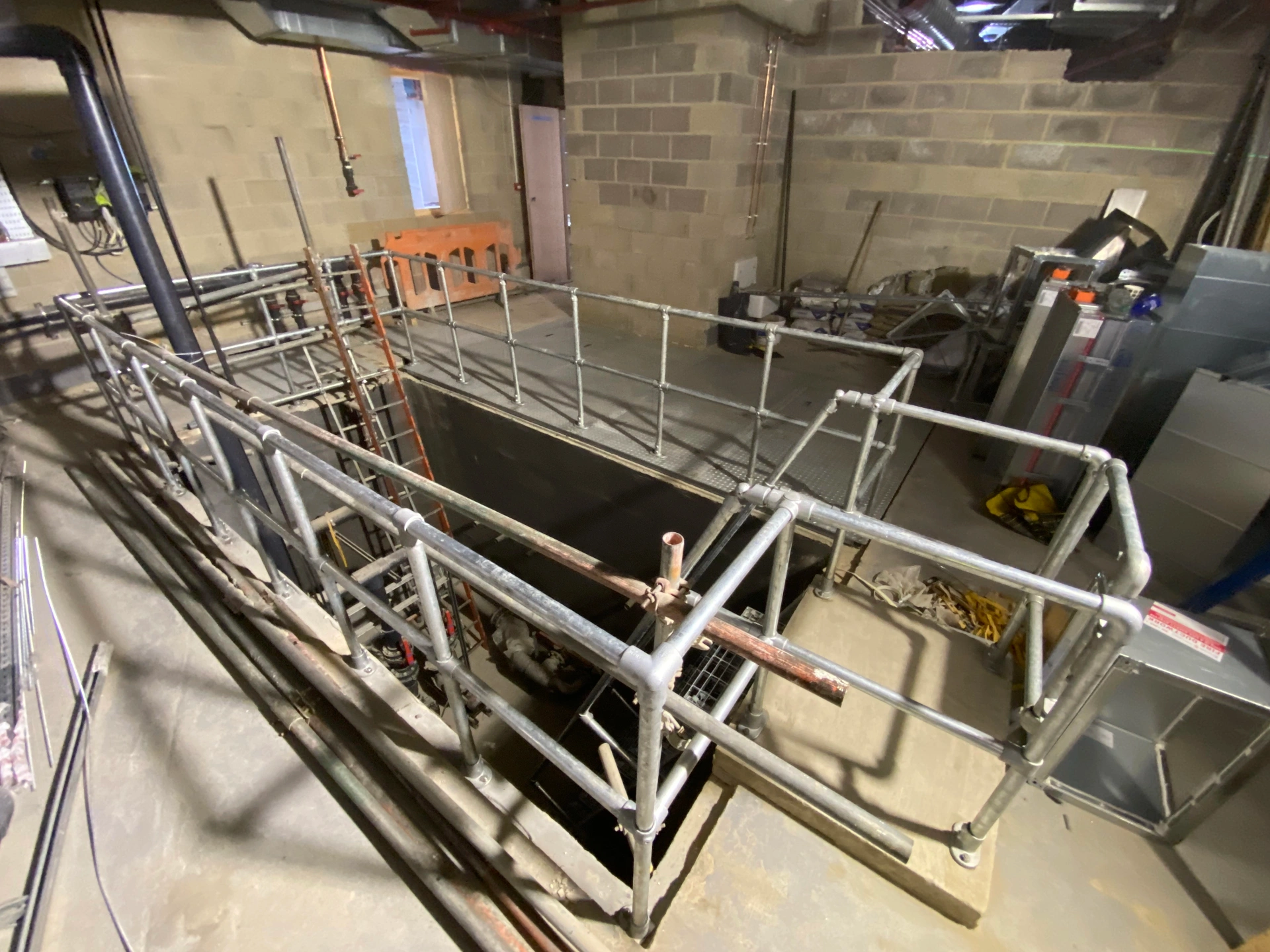 Spa — engineered tubular handrail and edge-protection system around plant void, fabricated and installed by Westlind