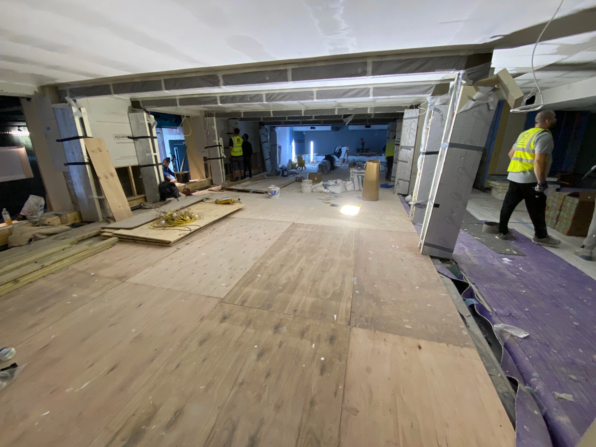 Spa — adjacent treatment hall during fit-out, with co-ordinated structural openings and protected substrate ready for finishing trades